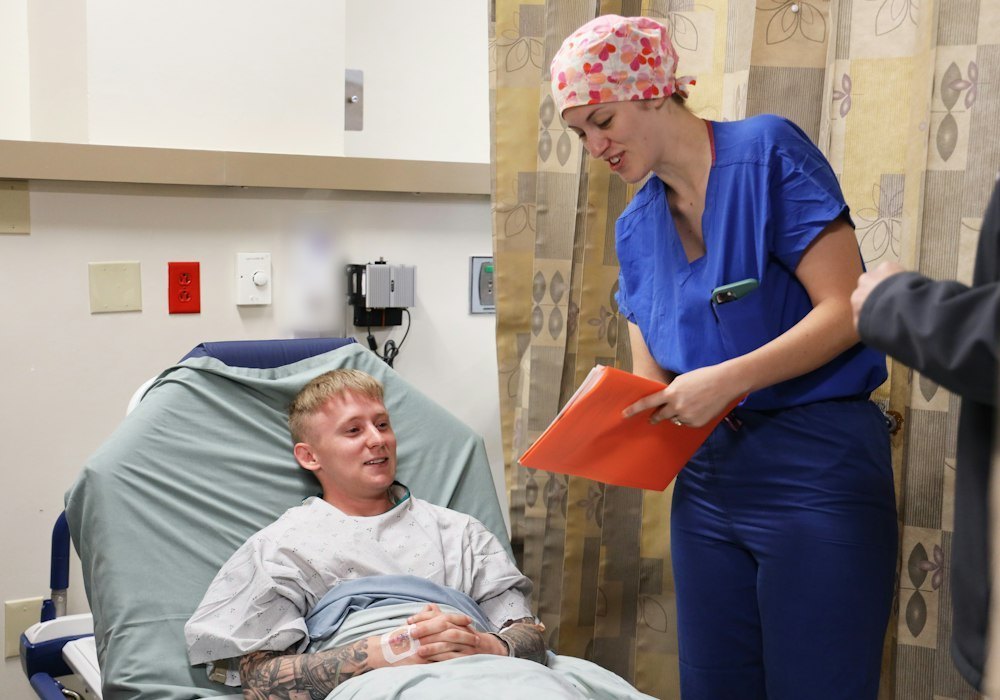 Nurse talking with a patient during a hospital visit