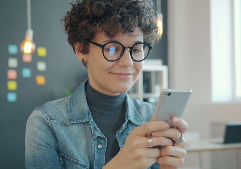 Woman reading on her phone